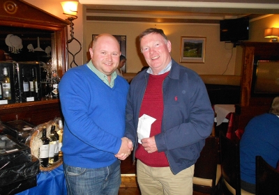 Hole-in-One Man!
Sean Sheehan ran away with €199 from the 2s Club after he aced the 4th hole at The Heritage and claimed the whole pot. Here we see Captain Jonathan Smith reluctantly handing over all the Society's cash.
