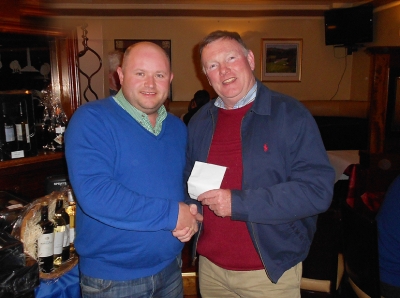 Sean Sheehan
Sean Sheehan ran away with €199 from the 2s Club after he aced the 4th hole at The Heritage. Here we see Captain Jonathan Smith reluctantly handing over all the Society's cash.
