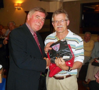 President Jim Murray presents the overall winners prize to Eugene Lucey
