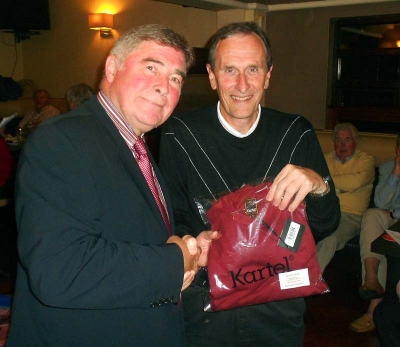 President Jim Murray presents the prize for Nearest the Pin to John Fitzgerald
